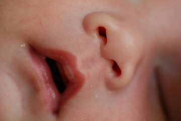 close up mouth and nose newborn baby softness sensitive skin