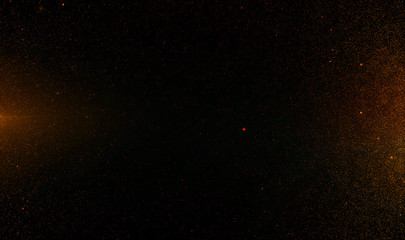 Abstract retro 1920 style vintage background of flickering gold tone particles and light flare