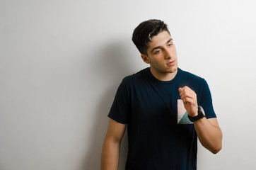 Young man looking to the side and thinking