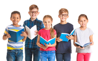 Fototapeta na wymiar Cute little children reading books on white background