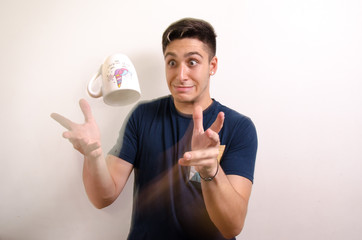 Young man with a jug in the air