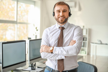 Portrait of male technical support agent in office