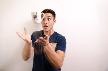 Young man with a jug in the air