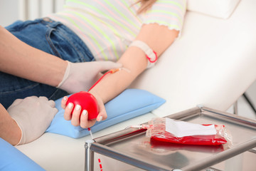 Woman donating blood in hospital
