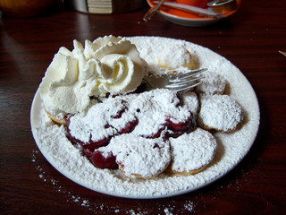 Poffertjes are traditional Dutch batter treat. Poffertjes are small, fluffy pancakes made of yeast and buckwheat flour.