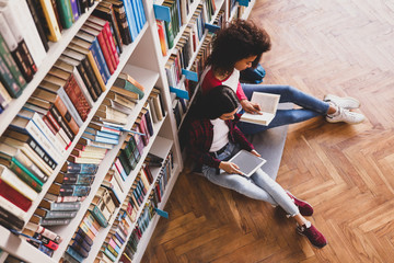 Young students preparing for exam in library