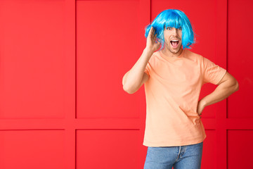 Man in funny disguise on color background. April fools' day celebration