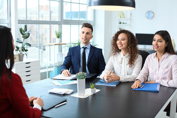Human resources commission interviewing woman in office