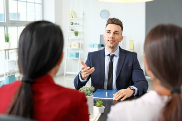 Human resources commission interviewing man in office