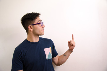 Young man pointing with his fingers