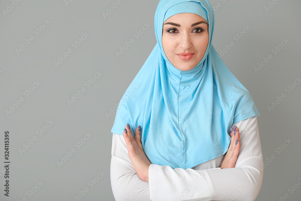 Poster Beautiful Arab woman on grey background