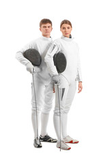 Young fencers on white background