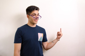 Young man pointing with his fingers