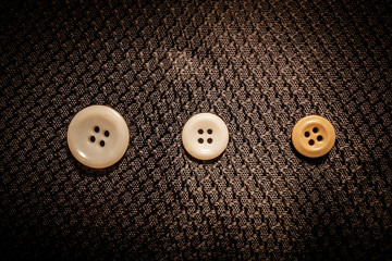 colored buttons in a row on black background