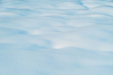 White and blue snowy texture of natural snow surface