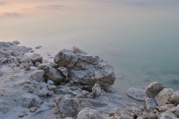Sunrise over the Dead Sea shore in Israel. The lowest place on Earth. Salt crystals at sunrise