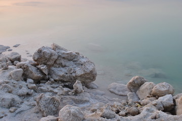 Sunrise over the Dead Sea shore in Israel. The lowest place on Earth. Salt crystals at sunrise