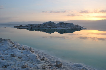 Sunrise over the Dead Sea shore in Israel. The lowest place on Earth. Salt crystals at sunrise