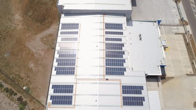 Solar panel installation on warehouse roof