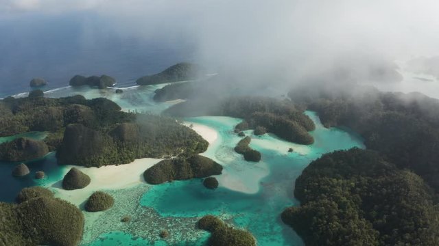 Drone of Wayag Islands in Raja Ampat, Indonesia. Hundreds of limestone islands in turquoise water. This tropical region has the most biodiverse waters on earth.