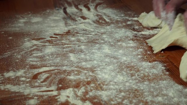 Fold bruscetta dough and sprinkle flour