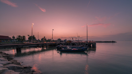 Fototapeta premium majestic sunrise over fisherman's jetty area