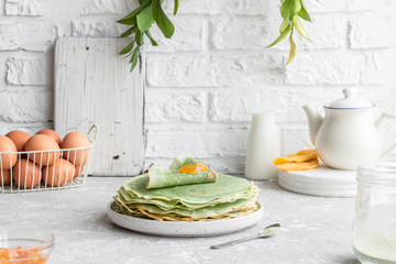 Green pancakes with matcha tea and mango jam