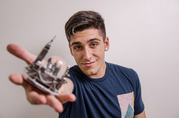 Young man holding a NEW YORK souvenir