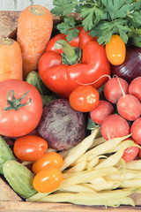 Healthy vegetables in wooden box as snack containing vitamins
