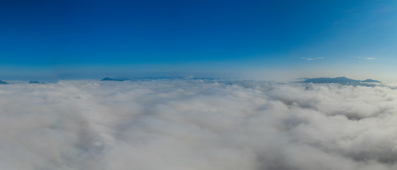 Naklejka na ściany i meble Panoramic Fog and clouds over Mountains