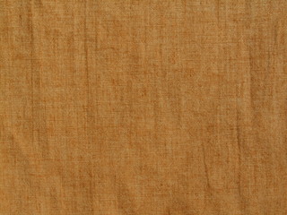 Rough cotton fabric background. Red brown grunge background. Old shabby grungy fabric background.