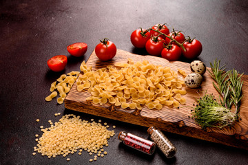 Ingredients for cooking paste on a dark background