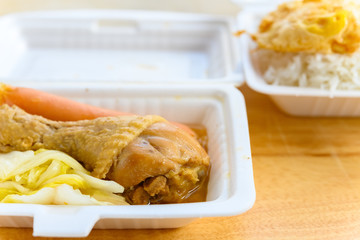 fast food of steamed chicken leg and sausage and fried egg and cabbage and rice
