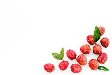 Lychee frame. Fresh juicy fruits on white background top-down copy space