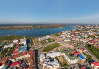 Aerial view of Tomsk city: city administration, Tom river. Summer, sunny day