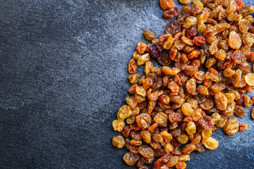 raisins, delicious dried grapes (fresh fruit vitamins) menu concept background. top view. copy space