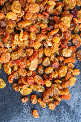 raisins, delicious dried grapes (fresh fruit vitamins) menu concept background. top view. copy space