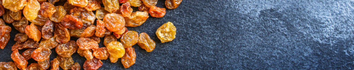 raisins, delicious dried grapes (fresh fruit vitamins) menu concept background. top view. copy space