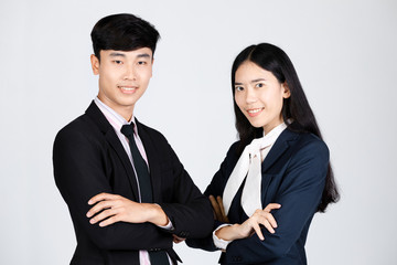Portrait of asian Man and woman standing on gray background.