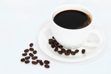 Coffee cup and beans isolated on white background.