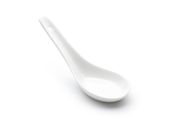 Empty ceramic spoon isolated on white background