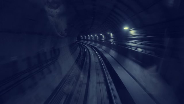 Train moves inside the underground tunnel, POV of the subway system and train moving on the railway