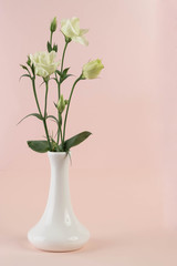 bunch of white eustoma flowers in glass vase