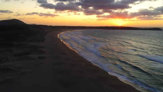 Beautiful Sunset at Beach of Valdovino, aerial zoom out view. Drone footage