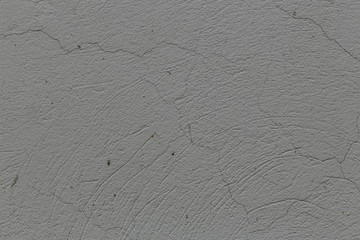 Fototapeta premium gray rough concrete wall abstract background with cracks