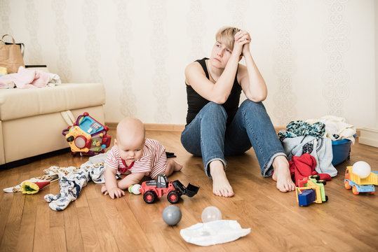 Mom Tired To Tidy Up The House. Child Scattered Toys. Children's Room. Mess In The House