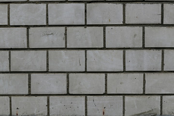 old rough gray brick wall