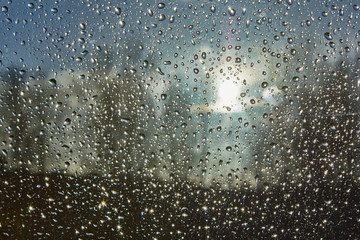 Naklejka na ściany i meble water drops on window after rain