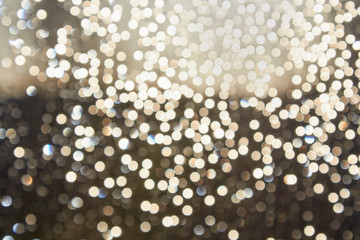 Abstract blurry colored background, unfocused water drops on glass