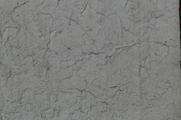 gray painted rough concrete wall surface texture with cracks